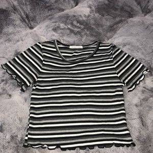 black, white, and grey short sleeve crop top.